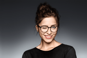 ZEISS model wearing glasses winks